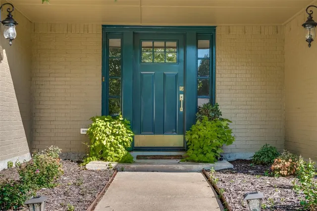 a view of front door of house and yard