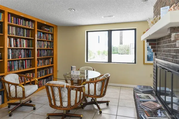 a dining room with furniture and a window