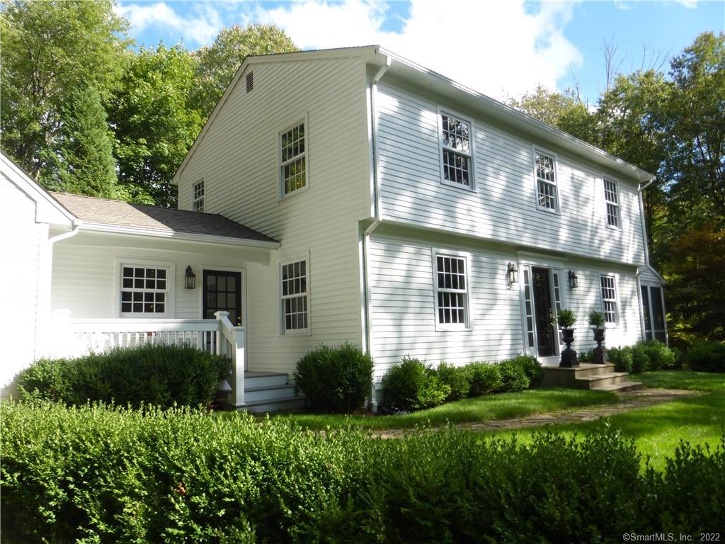 11 Woods Edge Road Bethlehem, CT 06751 - Photo 1 of 1 a front view of a house with a yard and trees
