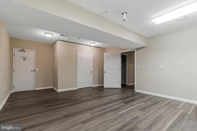 a view of a room with balcony and floor to ceiling window