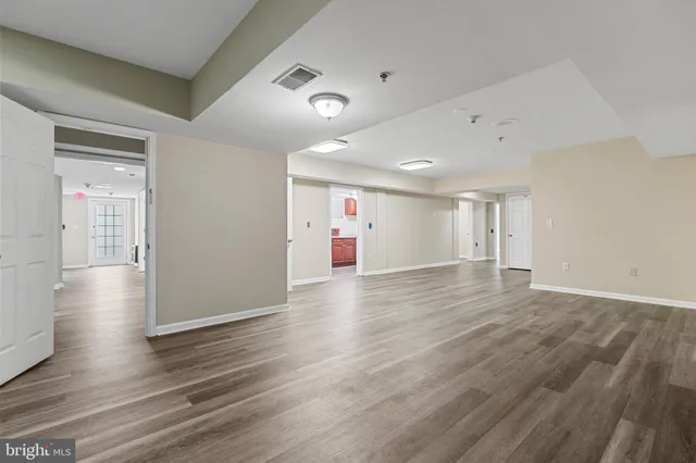an aerial view of residential house with outdoor space and trees all around
