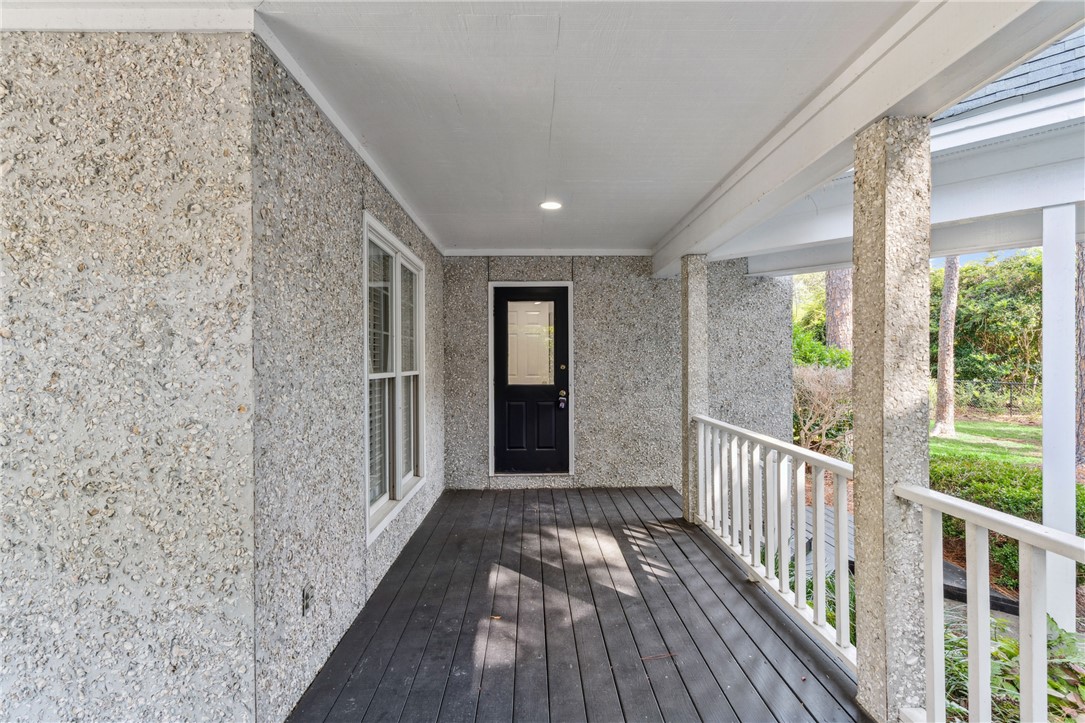 104 Augusta St. Simons Island, GA 31522 - Photo 51 of 63 Wrap around porch to side door