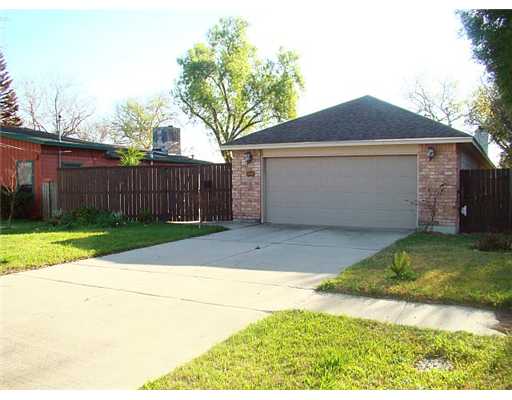 a view of a backyard of the house