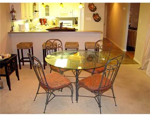 a dining room with furniture and a window