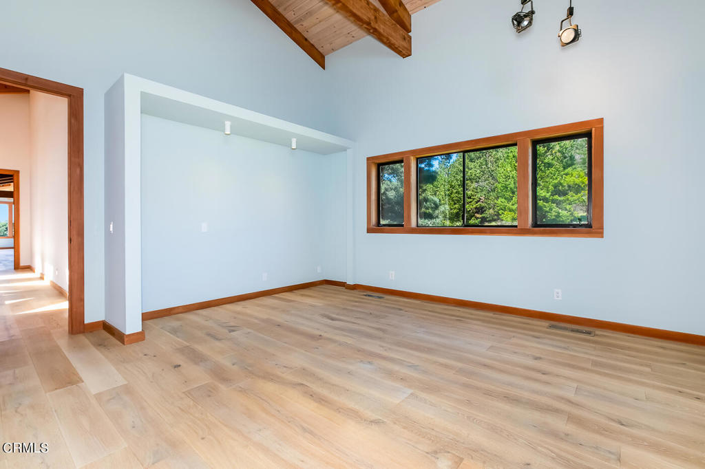 45460 Indian Shoals Road Mendocino, CA 95460 - Photo 30 of 50 an empty room with wooden floor and windows