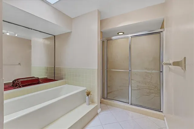 a bathroom with a bathtub and a shower