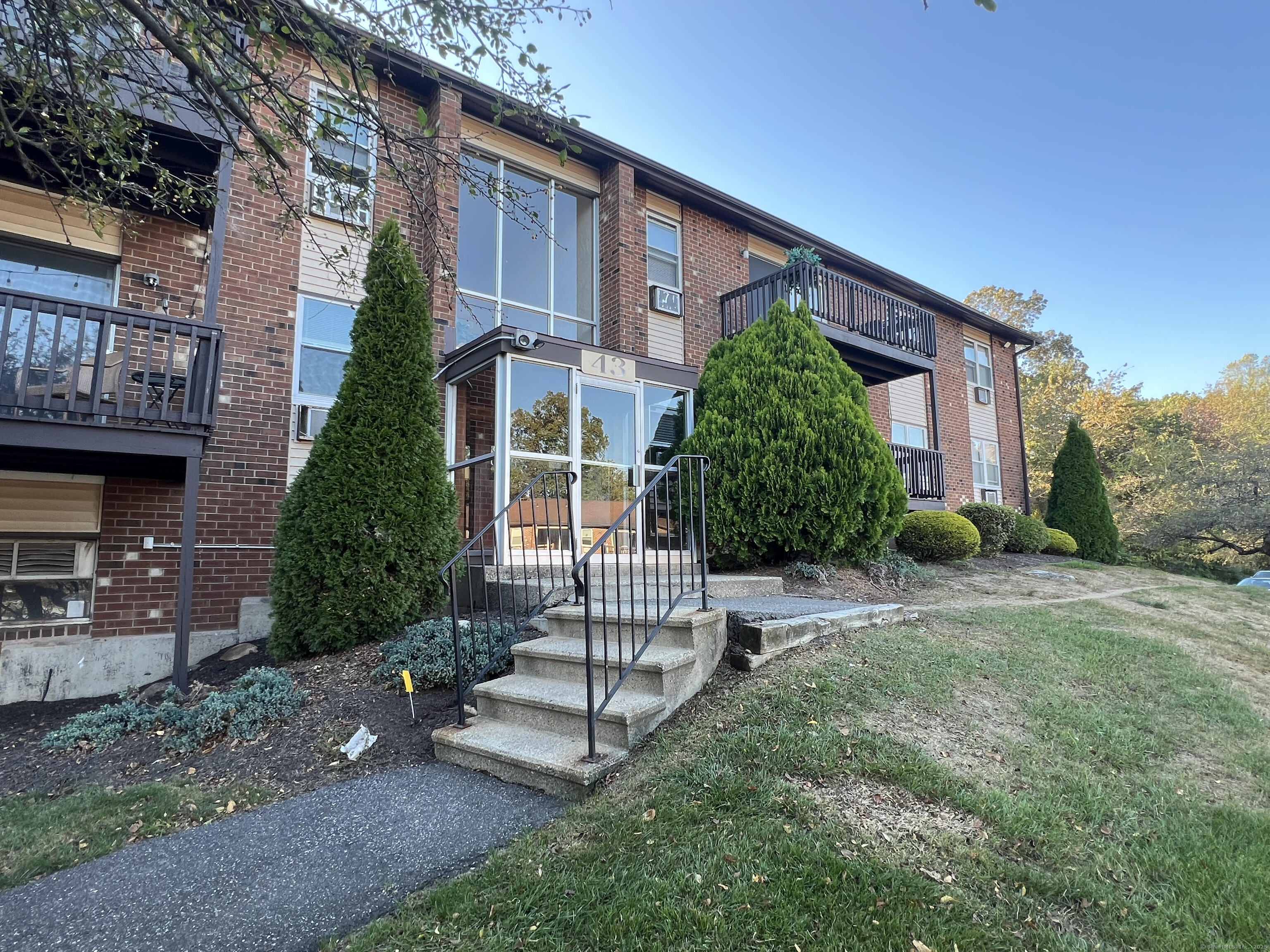43 Balance Rock Road, Unit 9 Seymour, CT 06483 - Photo 1 of 1 a front view of a house with a yard