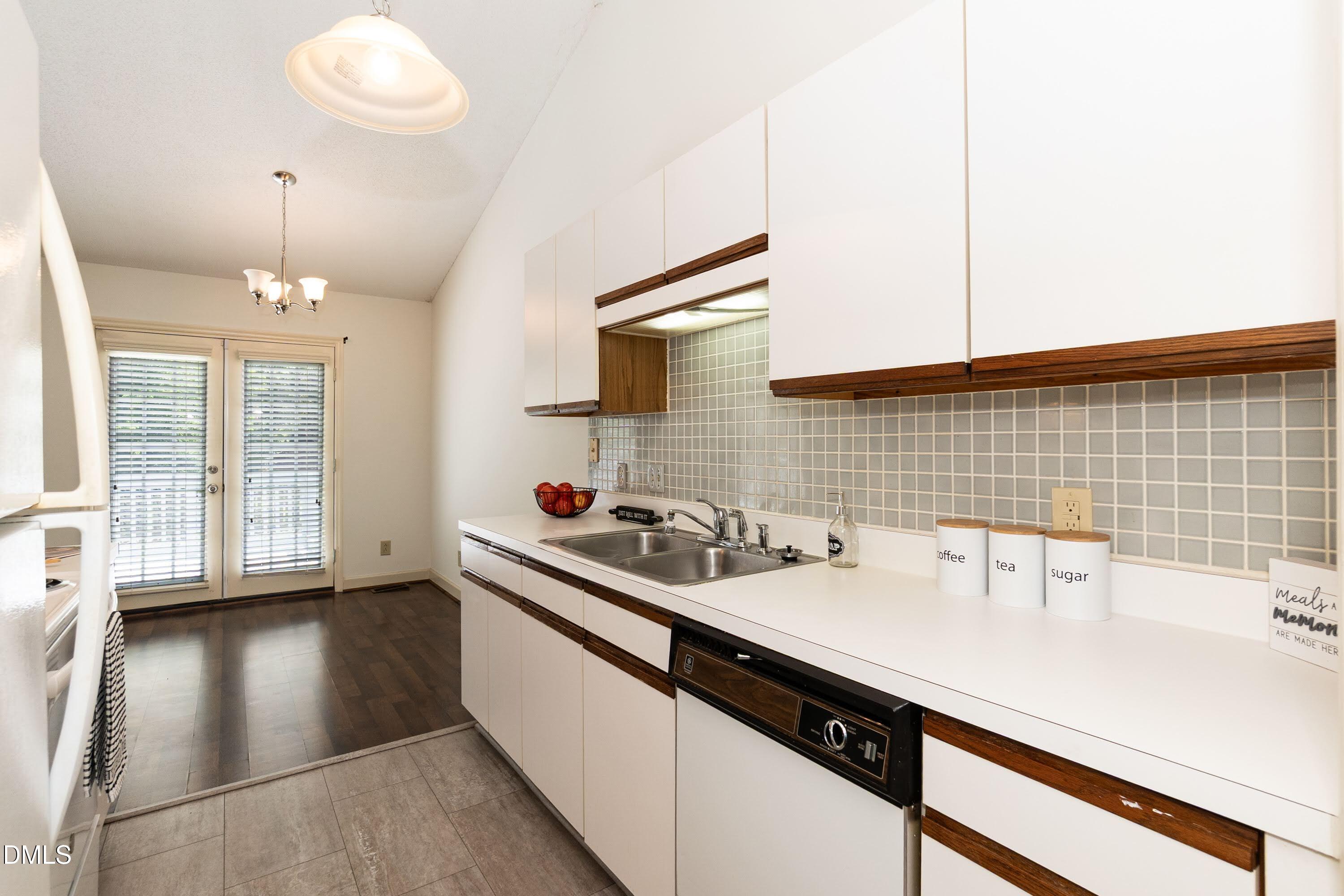 5604 Spring Pines Way Raleigh, NC 27616 - Photo 8 of 22 a kitchen with a sink and cabinets