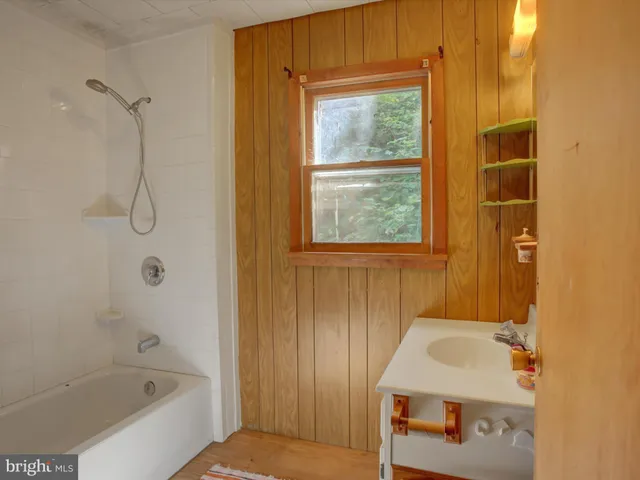 a bathroom with a sink and a bathtub