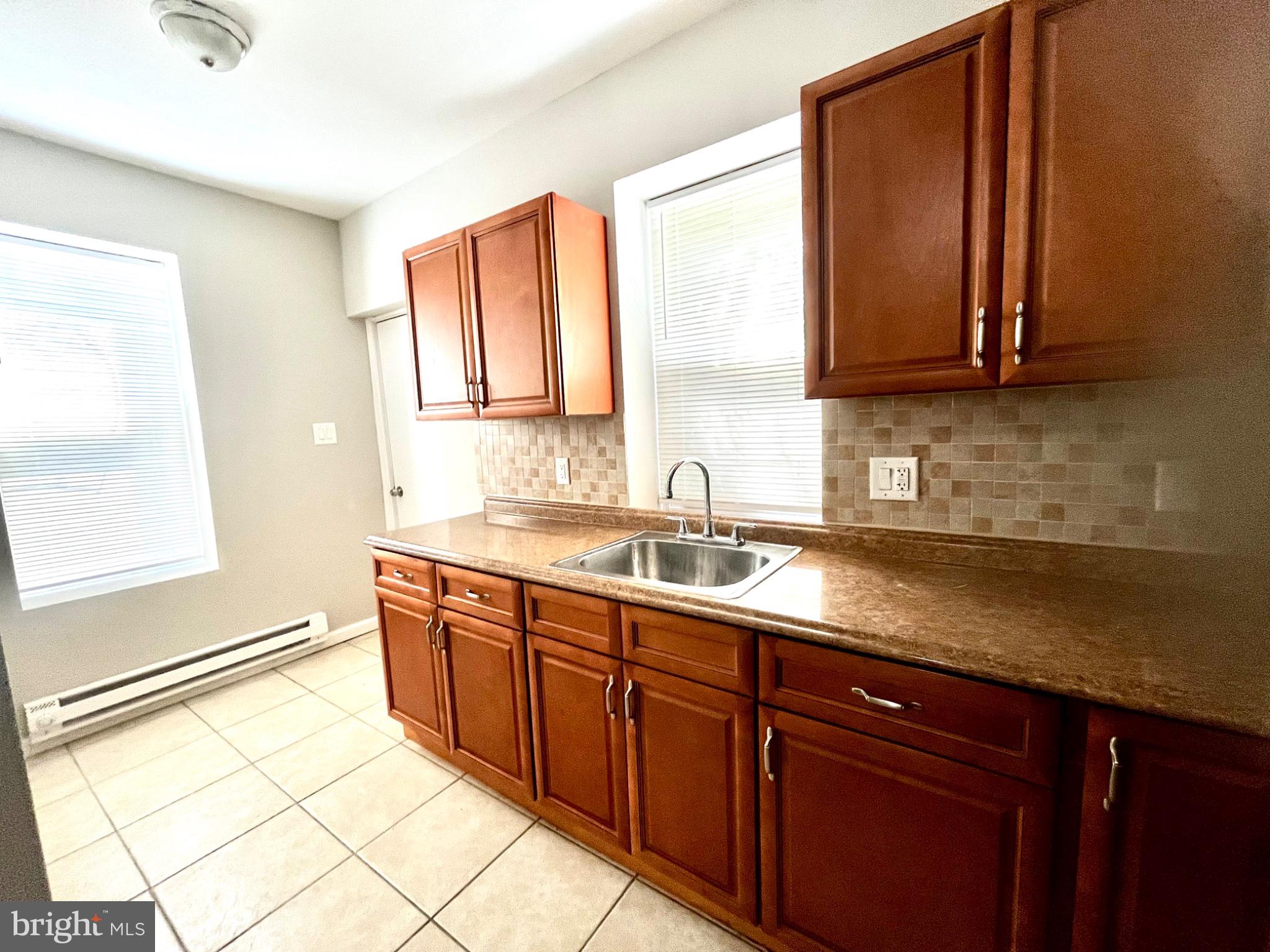 7106 Devon Street, Unit 1 Philadelphia, PA 19119 - Photo 10 of 11 Bright kitchen with modern finishes.