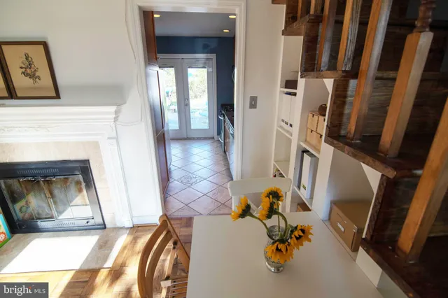 a view of living room with furniture and a fireplace