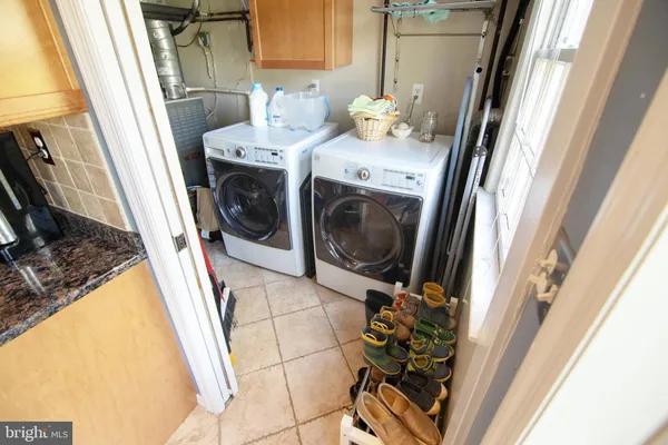 a utility room with a sink a washer and dryer