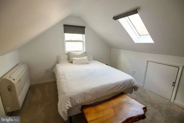 a bed room with a bed and a walk in closet