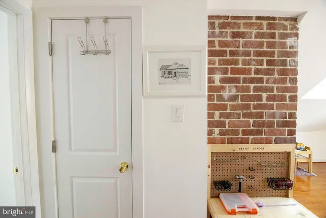wooden floor with table and chairs