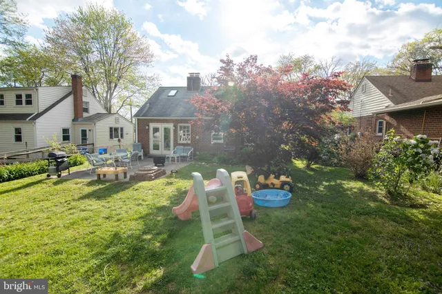 a view of a patio with table and chairs and potted plants