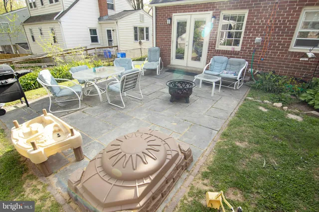 a view of house with backyard and patio
