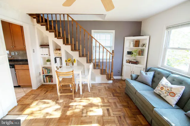 a living room with furniture and a rug