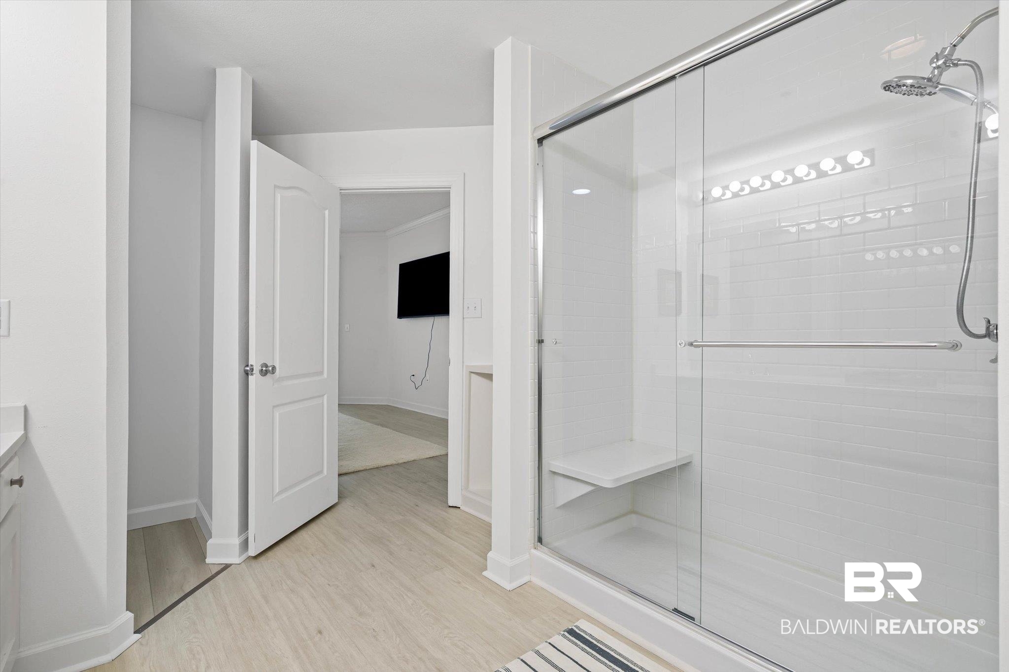27770 Canal Road, Unit 2102 Orange Beach, AL 36561 - Photo 7 of 19 Bathroom featuring vanity and a shower stall