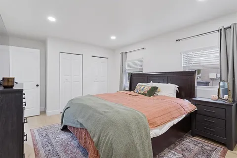 a bed room with a bed and a dresser