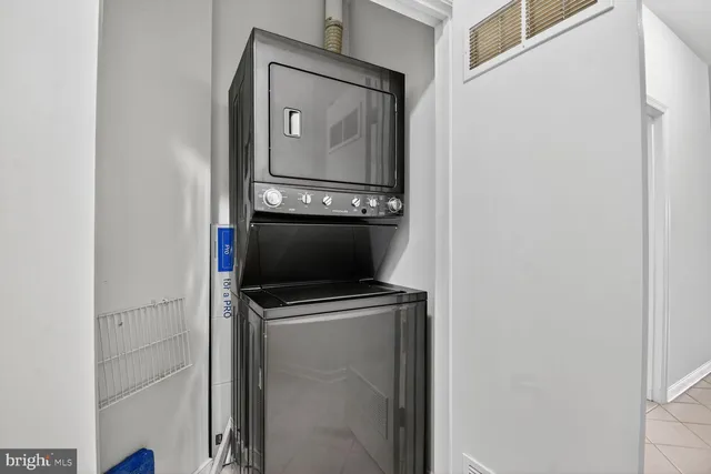 a view of a patio with couple of chairs and a table