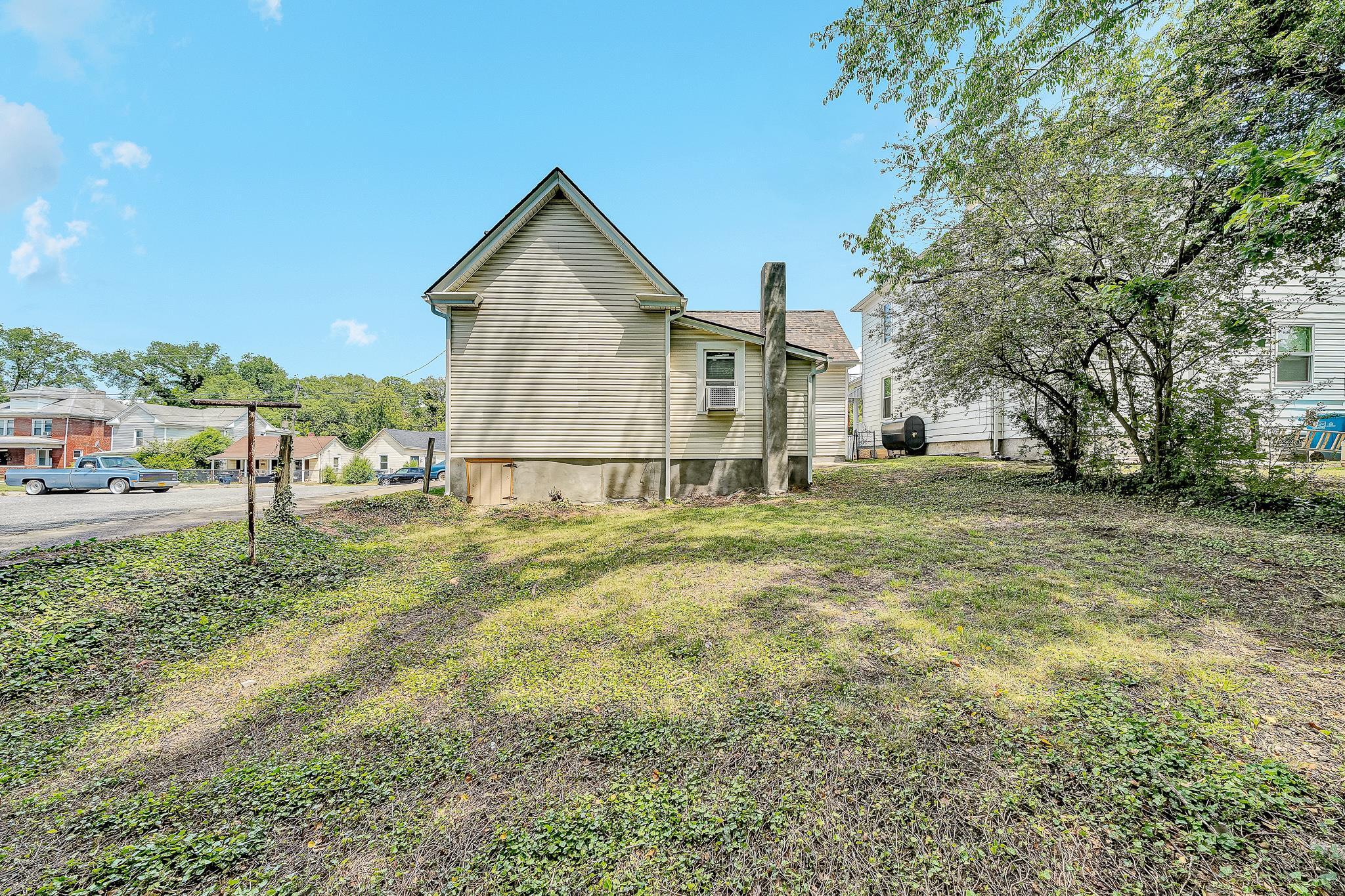 528 Rutherford Avenue Northwest Roanoke, VA 24016 - Photo 13 of 13 a view of an house with backyard space and garden