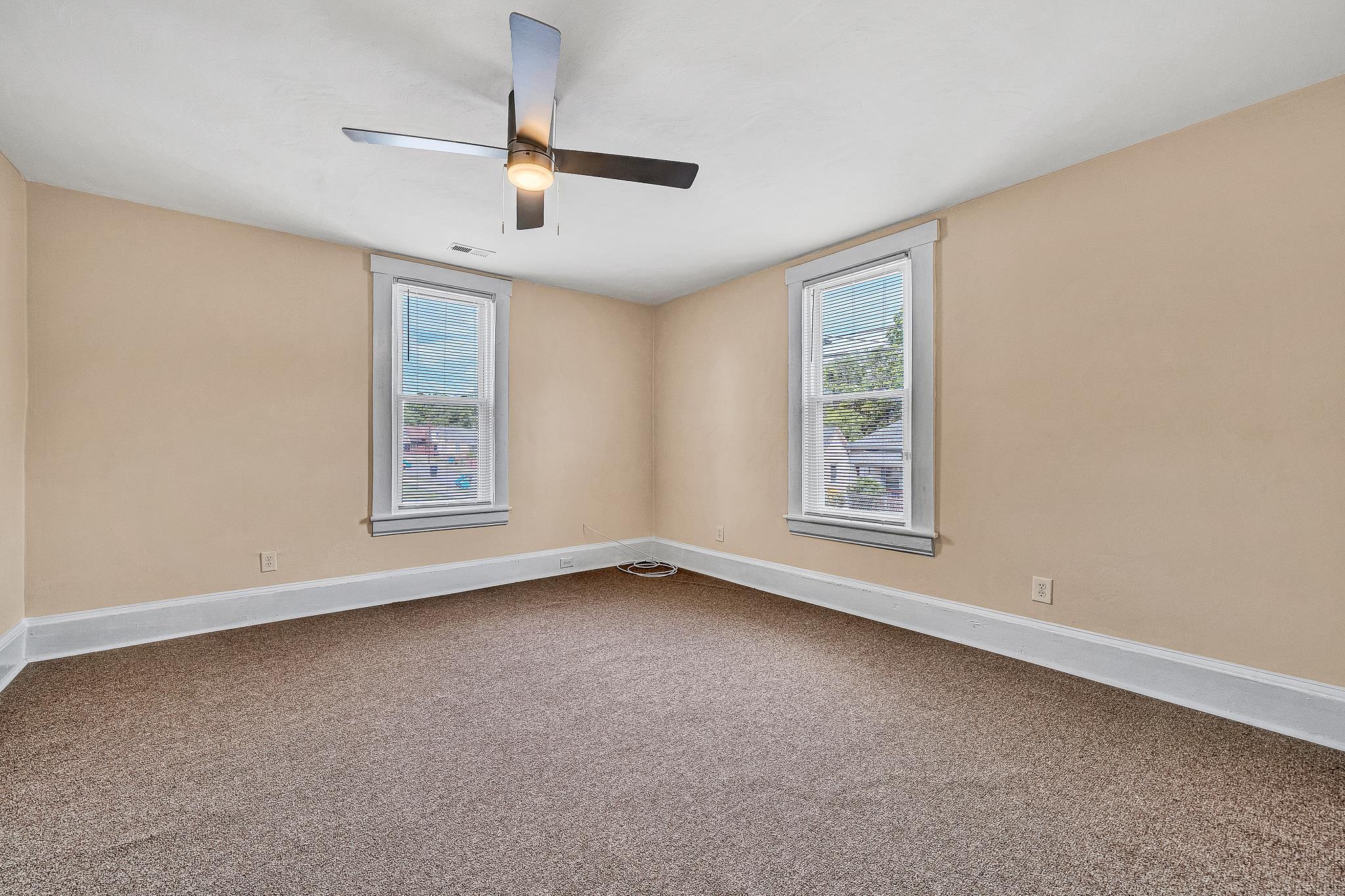 528 Rutherford Avenue Northwest Roanoke, VA 24016 - Photo 4 of 13 a view of an empty room with a window