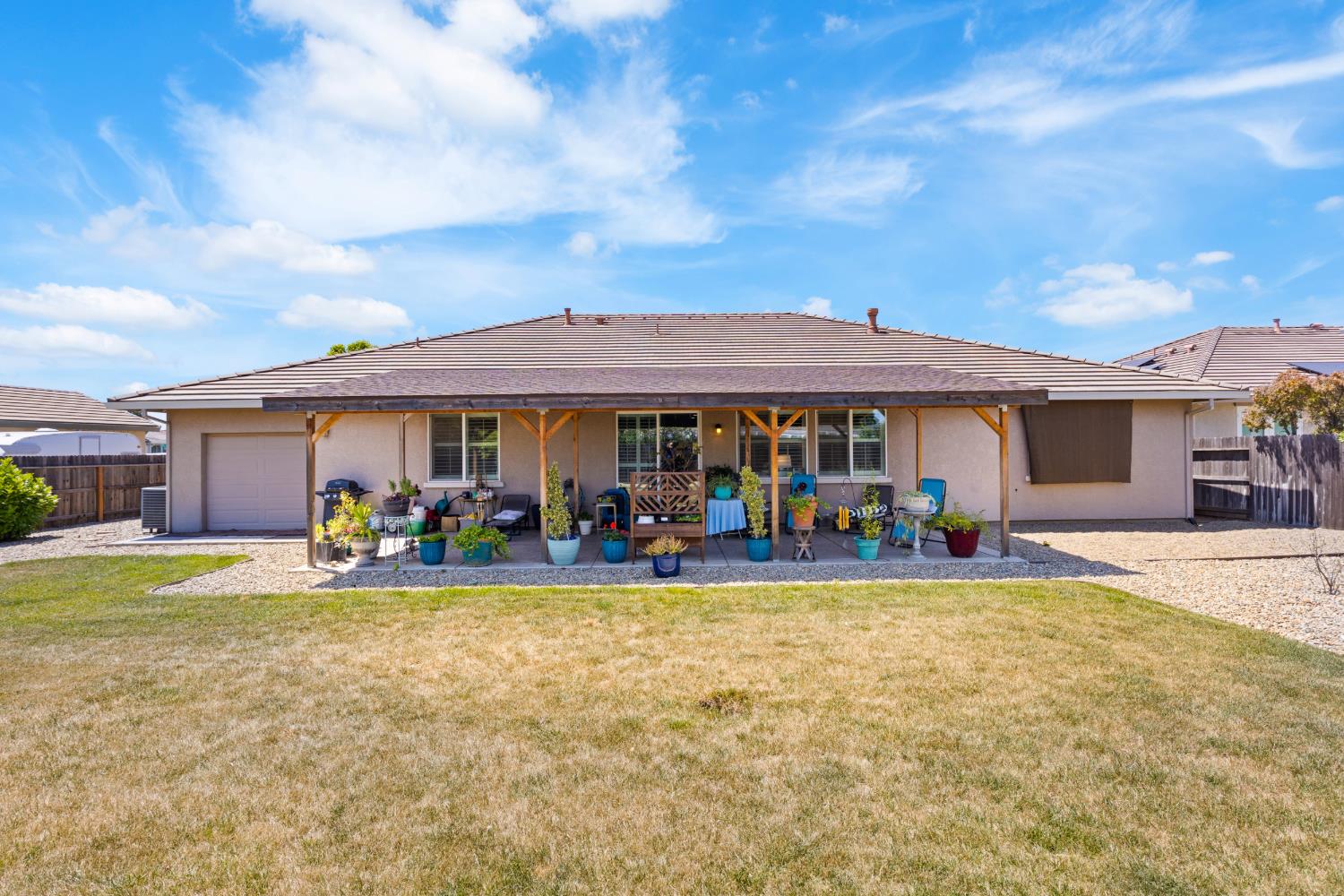2011 Roy Ranch Way Plumas Lake, CA 95961 - Photo 27 of 49 a view of a house with swimming pool and a yard