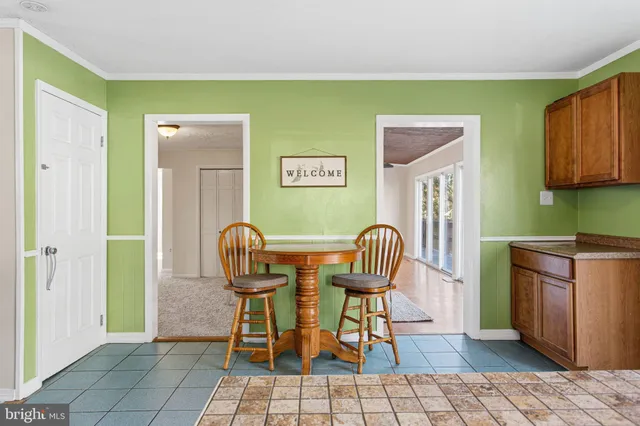 a view of a kitchen with granite countertop breakfast area