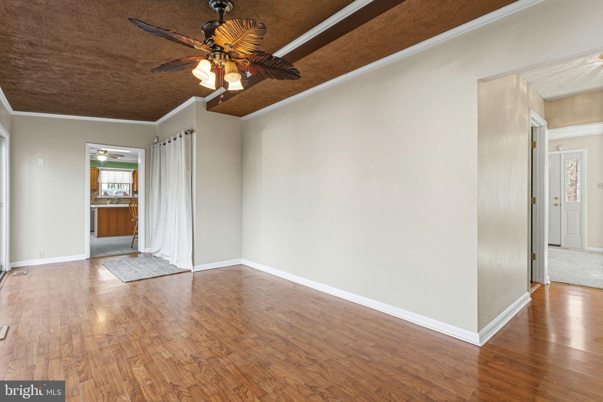 43 Woodside Drive Tabernacle, NJ 08088 - Photo 13 of 35 a view of an empty room with window and wooden floor