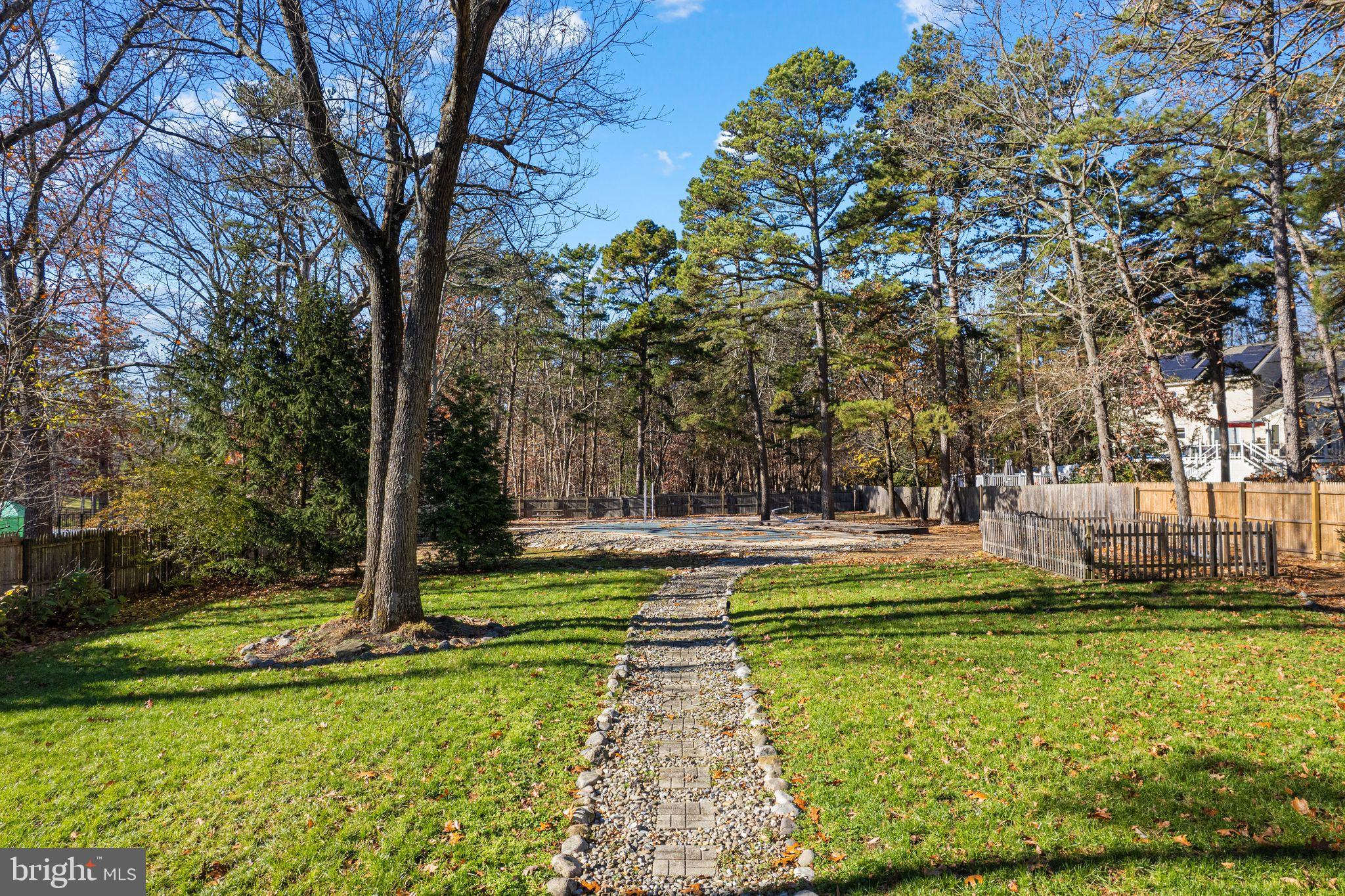 43 Woodside Drive Tabernacle, NJ 08088 - Photo 30 of 35 a view of a swimming pool with a yard