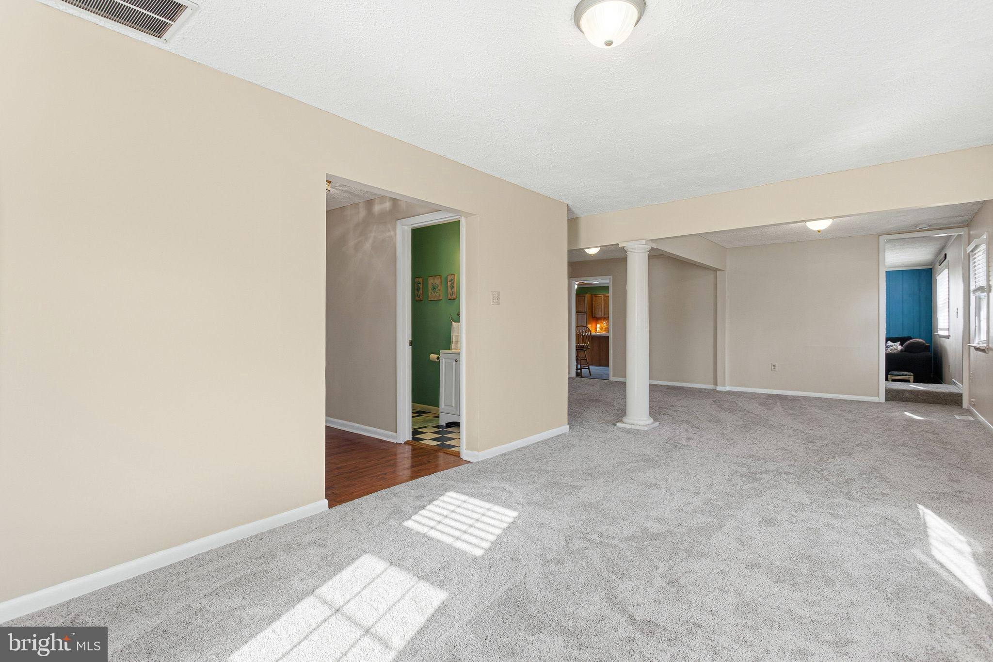 43 Woodside Drive Tabernacle, NJ 08088 - Photo 4 of 35 a view of an empty room with wooden floor
