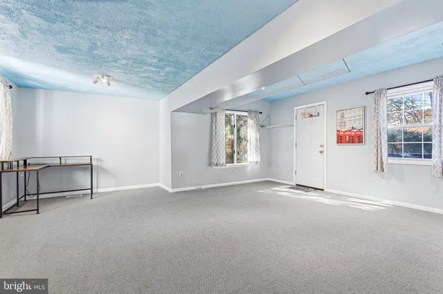 an empty room with windows