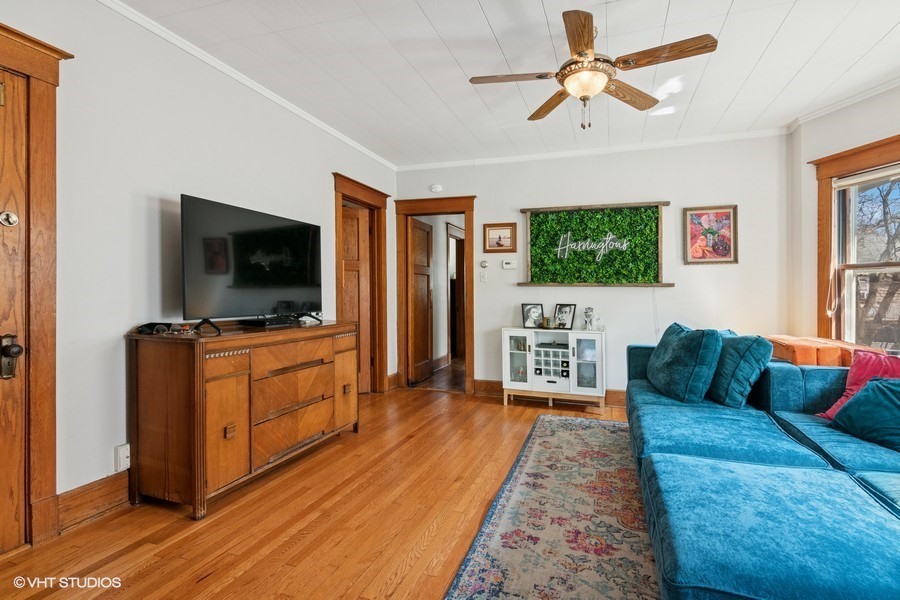 7227 Jackson Boulevard, Unit 2 Forest Park, IL 60130 - Photo 2 of 6 a living room with furniture and a flat screen tv