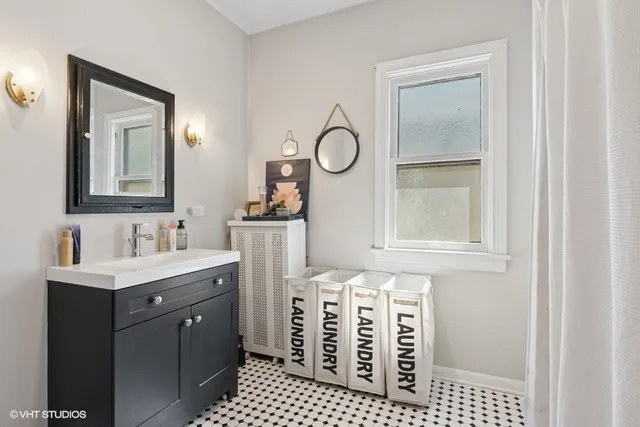 a bathroom with a sink a vanity and a mirror