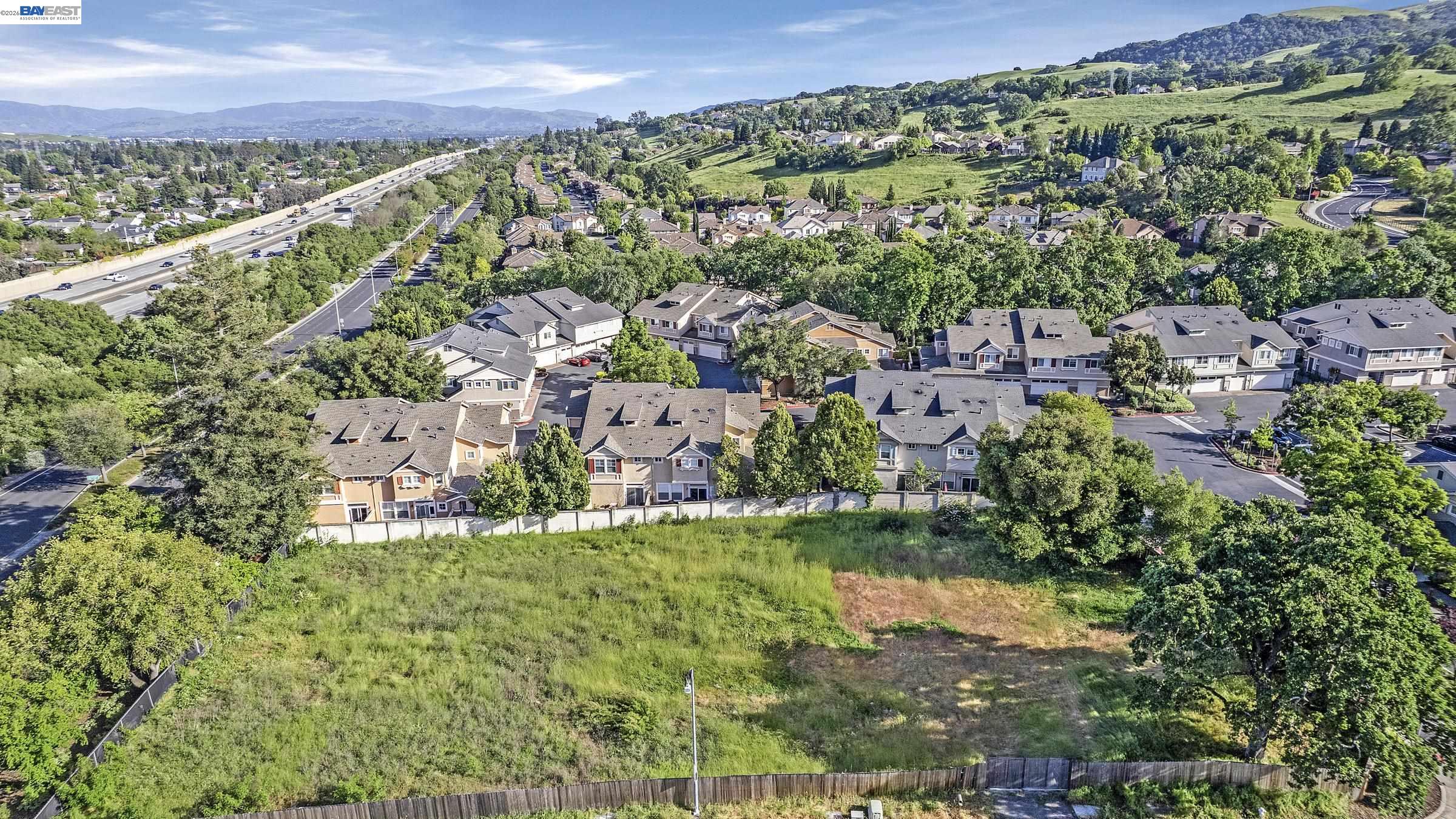 an aerial view of residential building and lake