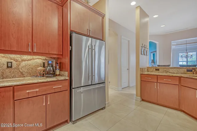 a living room with furniture a flat screen tv and a large window