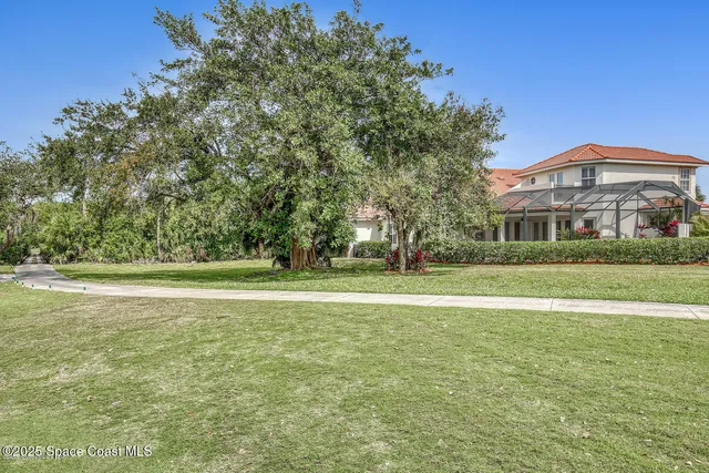 a view of a dining room with furniture wooden floor and windows