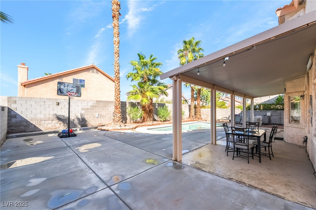 1081 Deep Well Court Henderson, NV 89011 - Photo 42 of 44 Fenced backyard featuring a patio and outdoor dining space