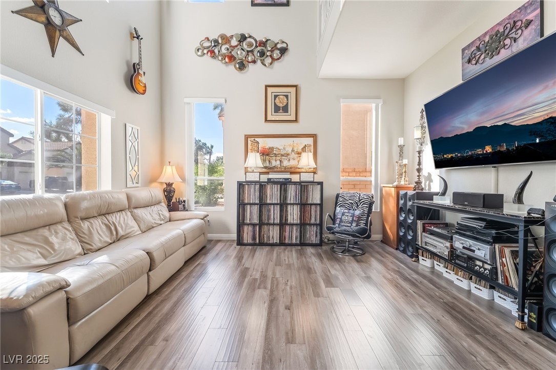 1081 Deep Well Court Henderson, NV 89011 - Photo 5 of 44 Living room with wood finished floors and a high ceiling