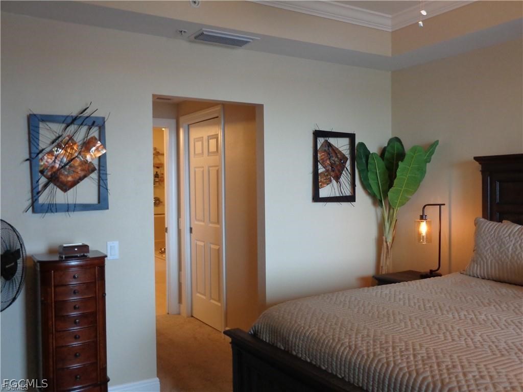 2743 First Street, Unit 1504 Fort Myers, FL 33916 - Photo 14 of 40 a bedroom with a bed and a window