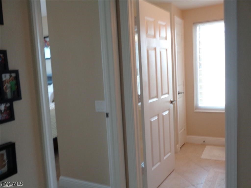 2743 First Street, Unit 1504 Fort Myers, FL 33916 - Photo 18 of 40 a view of a bathroom with a glass door