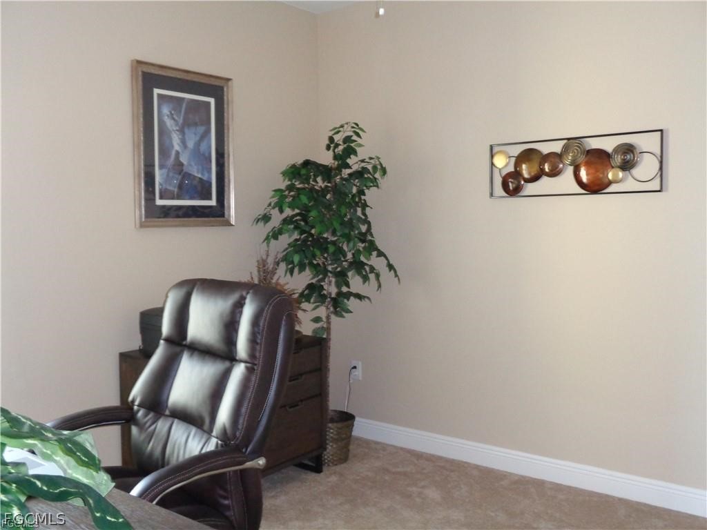 2743 First Street, Unit 1504 Fort Myers, FL 33916 - Photo 19 of 40 a living room with furniture and a potted plant