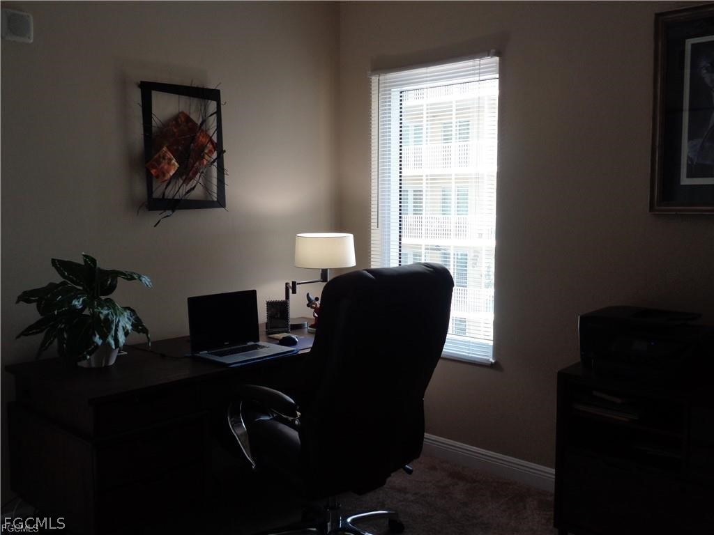 2743 First Street, Unit 1504 Fort Myers, FL 33916 - Photo 20 of 40 a view of a workspace with furniture and a window