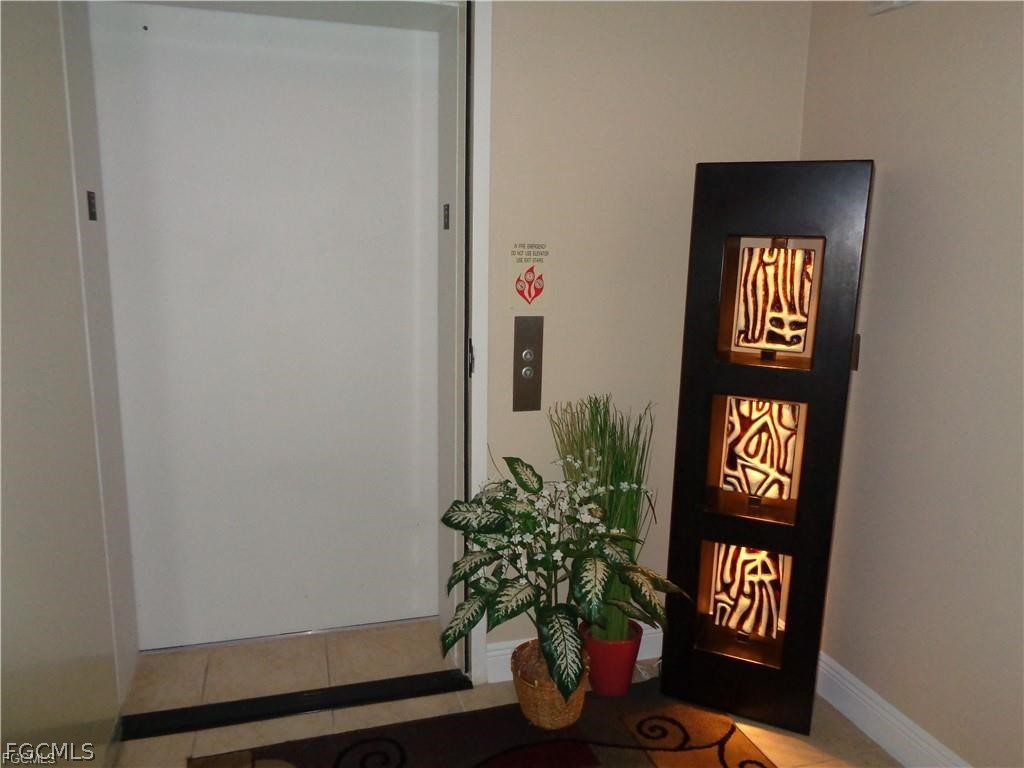 2743 First Street, Unit 1504 Fort Myers, FL 33916 - Photo 21 of 40 an entryway with a potted plant on a table