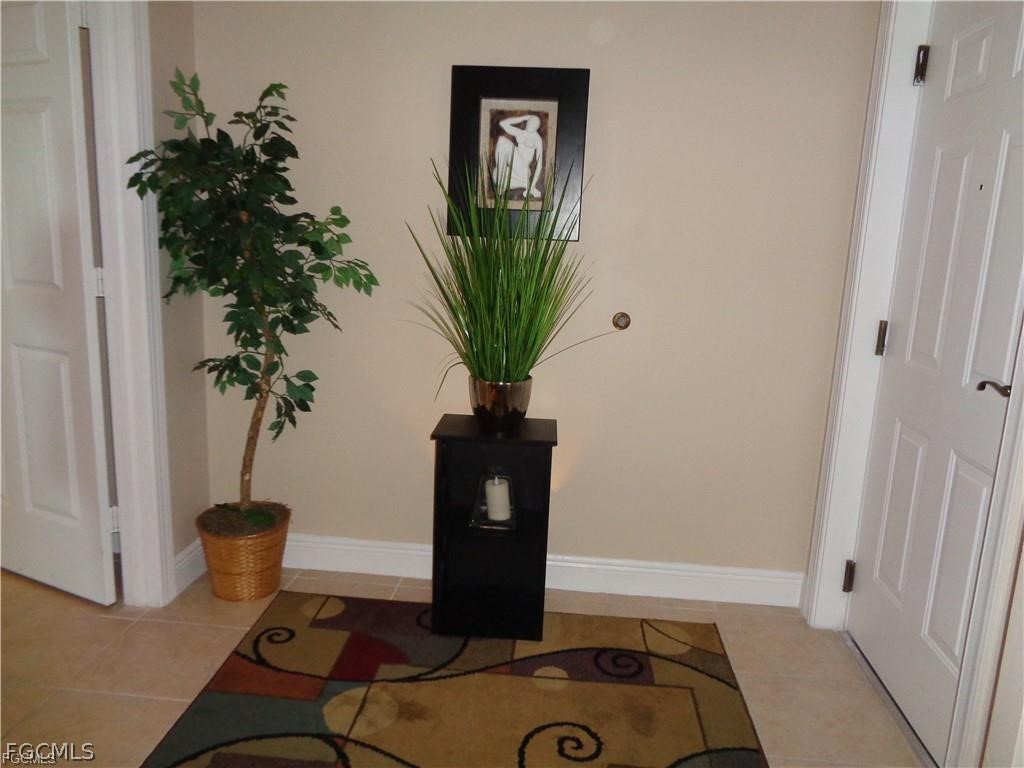 2743 First Street, Unit 1504 Fort Myers, FL 33916 - Photo 22 of 40 a vase of flowers sitting on a table