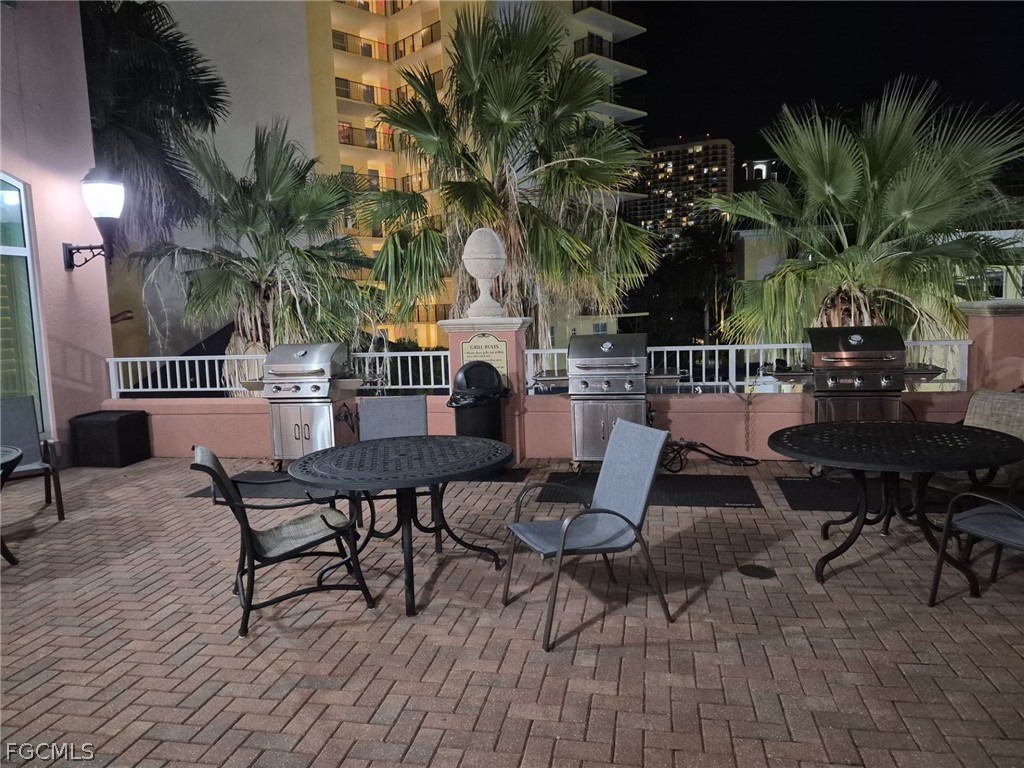 2743 First Street, Unit 1504 Fort Myers, FL 33916 - Photo 28 of 40 a view of a lounge chairs and table on the wooden floor