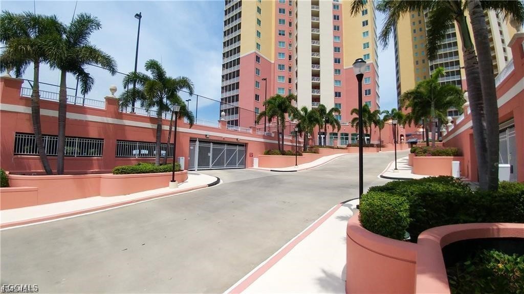 2743 First Street, Unit 1504 Fort Myers, FL 33916 - Photo 38 of 40 a view of a building with palm trees