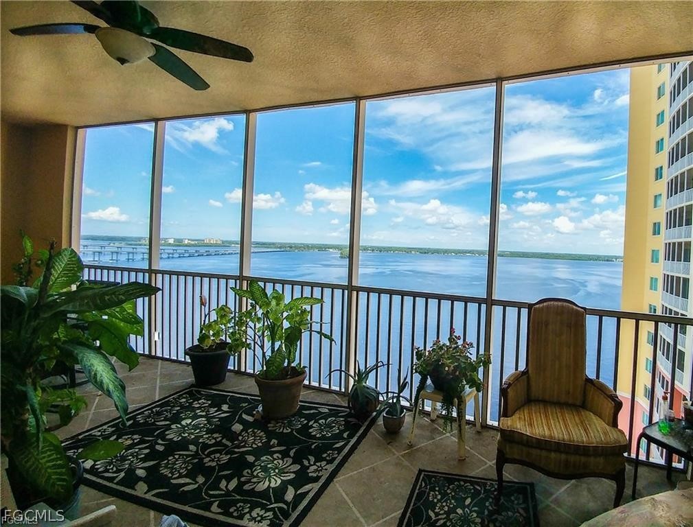 2743 First Street, Unit 1504 Fort Myers, FL 33916 - Photo 4 of 40 a living room with furniture and a potted plant