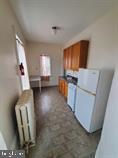 1335 Perkiomen Avenue, Unit 9 Reading, PA 19602 - Photo 4 of 8 a view of kitchen with furniture and wooden floor