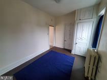 1335 Perkiomen Avenue, Unit 9 Reading, PA 19602 - Photo 7 of 8 an empty room with wooden floor and windows